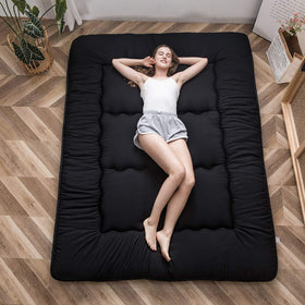 MAXYOYO Japanese floor mattress folded for compact storage and travel convenience.