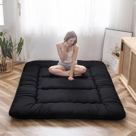MAXYOYO Japanese floor mattress folded in storage bag for portability and compact storage.