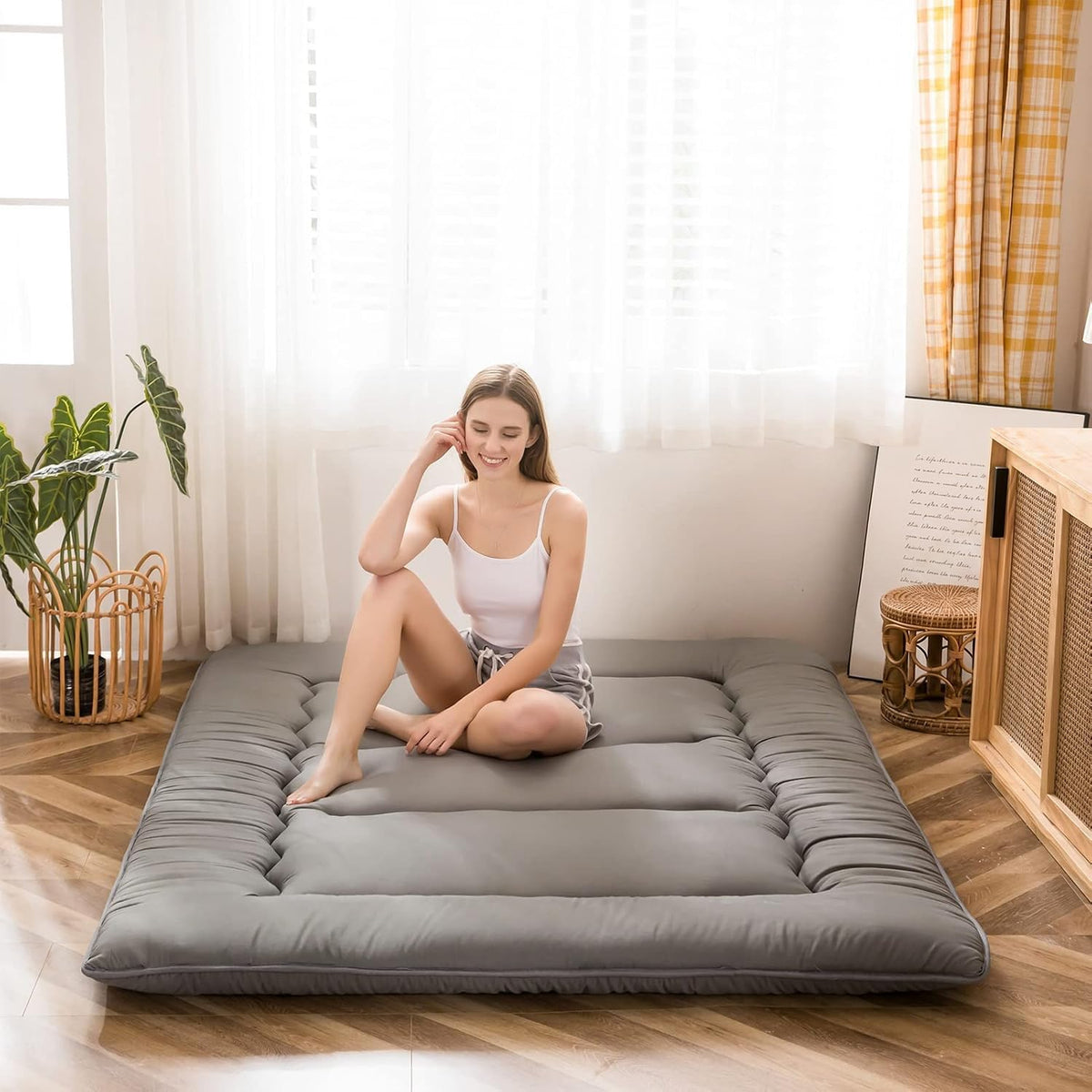 MAXYOYO Japanese floor mattress folded for compact storage and easy transport.