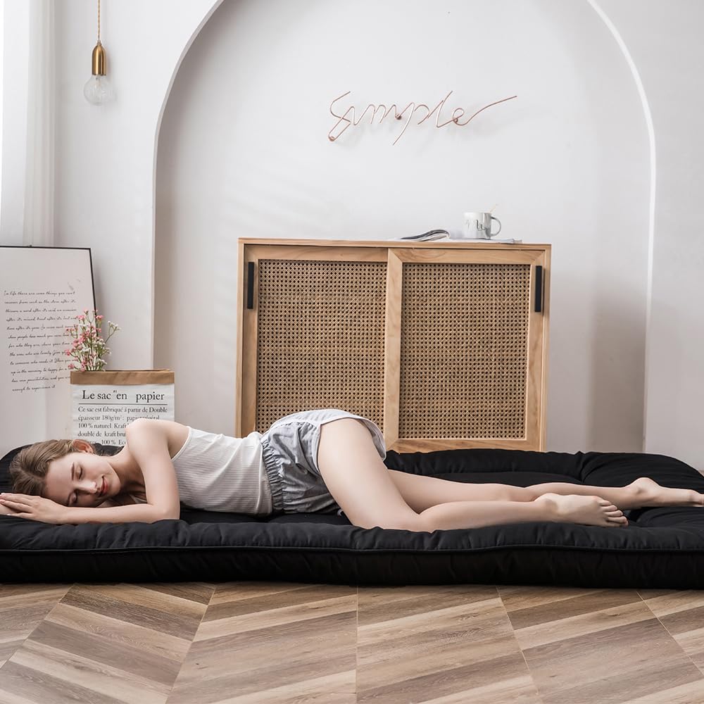 Open and unfolded MAXYOYO mattress ready for floor sleeping and lounging.