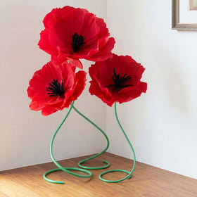 Maysing giant paper red poppy flowers standing tall for dramatic event decor.