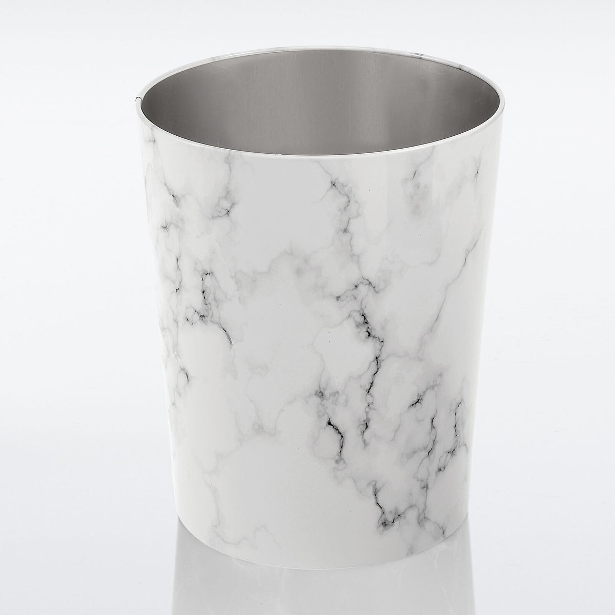 MDesign sleek compact wastebasket keeps rooms tidy and clutter-free.