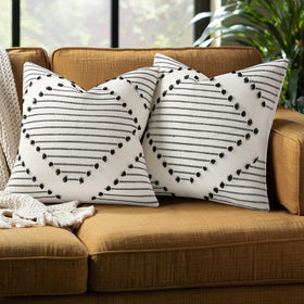 Mecatny boho-knit outdoor pillow cover with black tassels for patio decor.