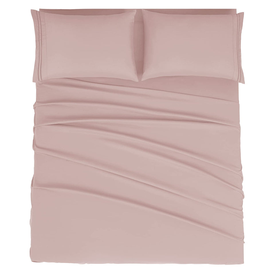 Mejoroom dusty pink king sheet set folded, luxurious softness for all-season comfort.