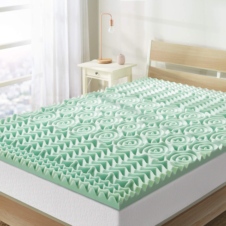 Mellow 1.5-inch 5-zone topper on bed for enhanced comfort.