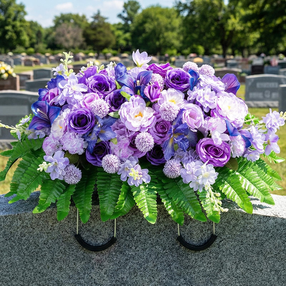 Memobloom cemetery saddle with purple roses and camellias for a vibrant grave tribute.