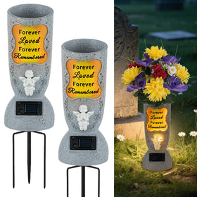 Memobloom cemetery vase with solar angel headstone illuminates the memorial at dusk