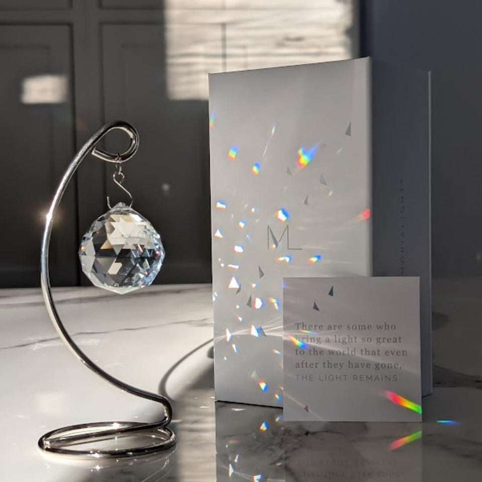 Memorialight crystal ball rainbow maker projecting daily rainbows in sunlight