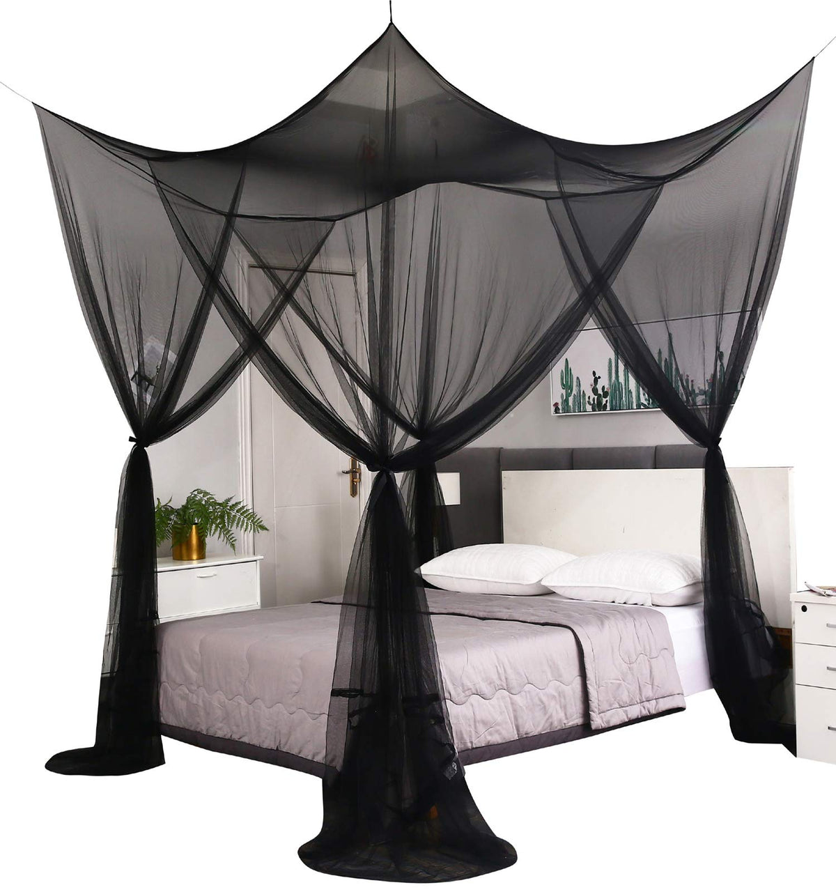 Mengersi bed canopy over a large bed offering insect protection and style.