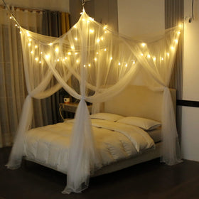 Mengersi bed canopy with lights on bed creates a romantic, elegant sleeping space.