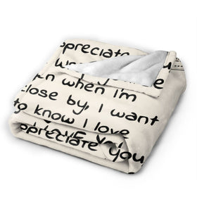 Menghao Dear Mom blanket 60x80 size folded on bed for cozy reading.