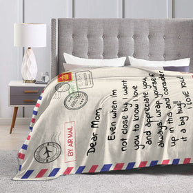 Menghao soft flannel throw draped on chair with luxurious feel.