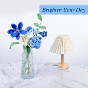 MengxFly crochet flower bouquet blue rose-detail highlights intricate stitching.