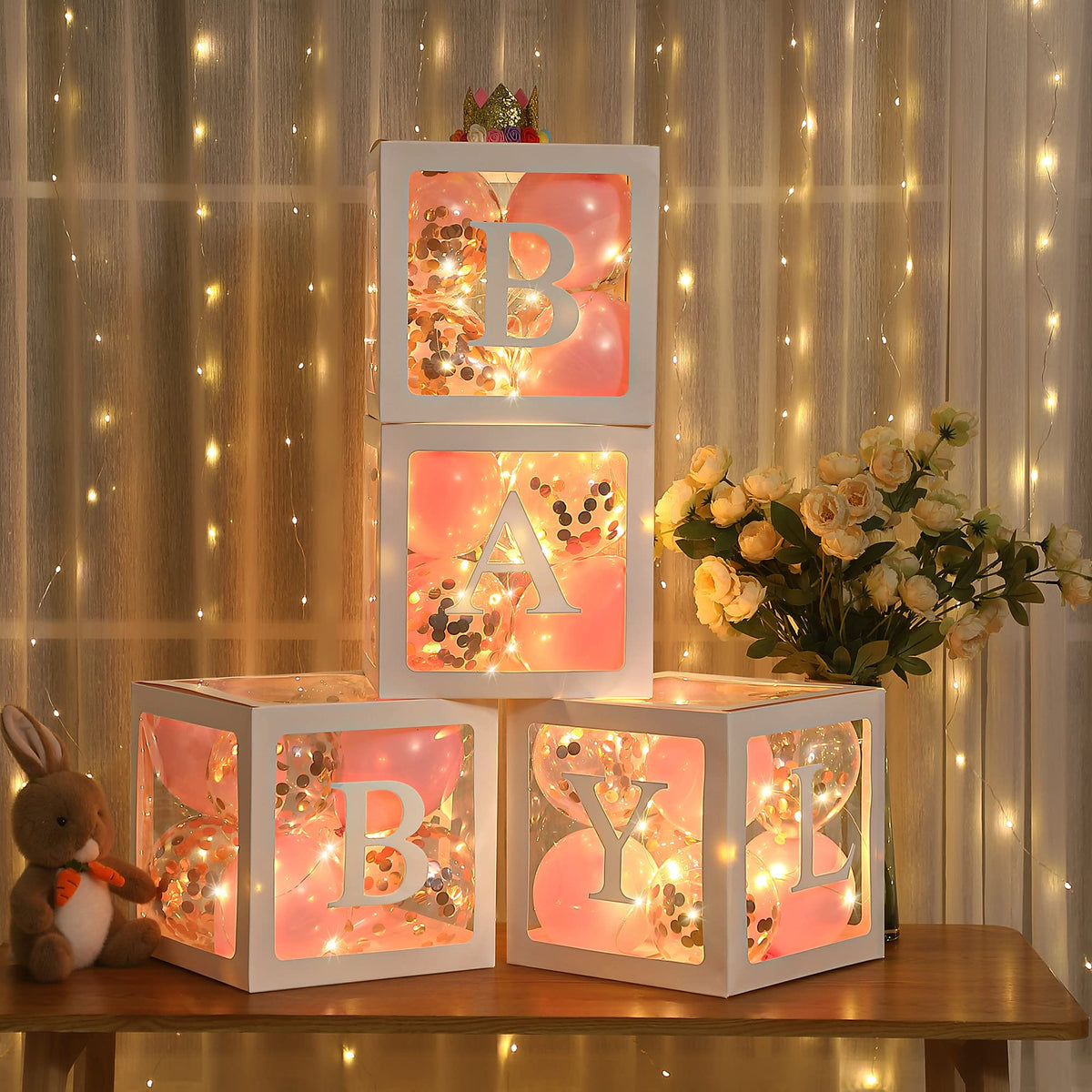 Meonum baby shower balloon boxes assembled for a polished gender reveal backdrop.