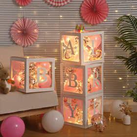 Meonum baby girl letters on the box create a personalized baby shower décor.