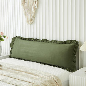 Merryword olive-green body pillow cover on bed adds warm shabby chic style.
