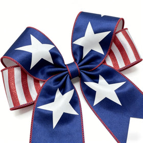 Meseey door bow crafted with patriotic ribbon for standout curb appeal.