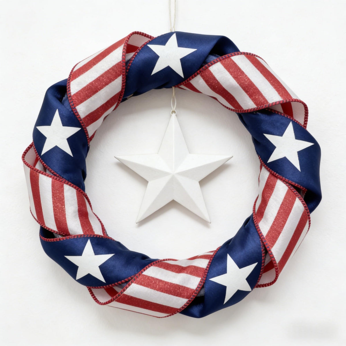 Meseey patriotic ribbon on wreath, holds shape for festive door accents.