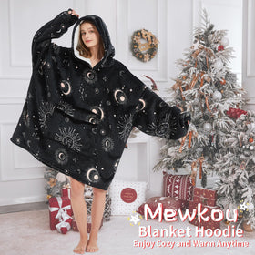 Mewkou wearable blanket hoodie in use on a couch for warmth.