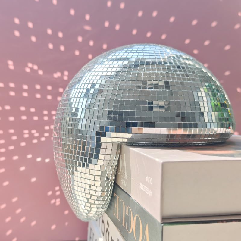 MFGDISCO handmade reflective sphere adds festive sparkle to a living room.