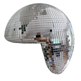 MFGDISCO melted disco ball decor on a shelf catching light with modern shimmer.
