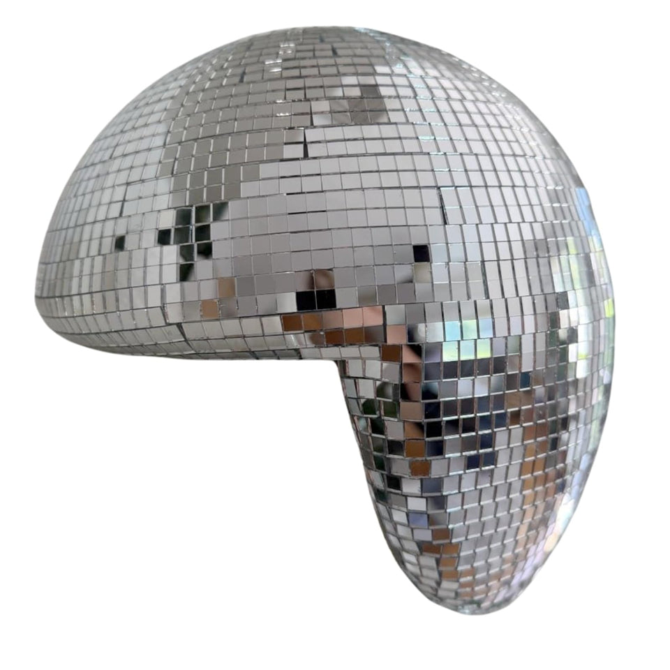 MFGDISCO melted disco ball decor on a shelf catching light with modern shimmer.