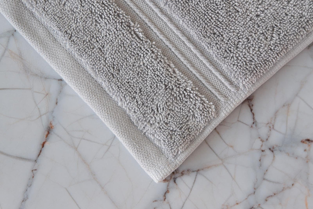 Milara Creations washcloth with hanging loop keeps towels dry and neatly stored