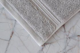 Milara Creations washcloth with hanging loop keeps towels dry and neatly stored