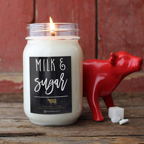 Milkhouse Candle Company jar featuring a black metal lid on display