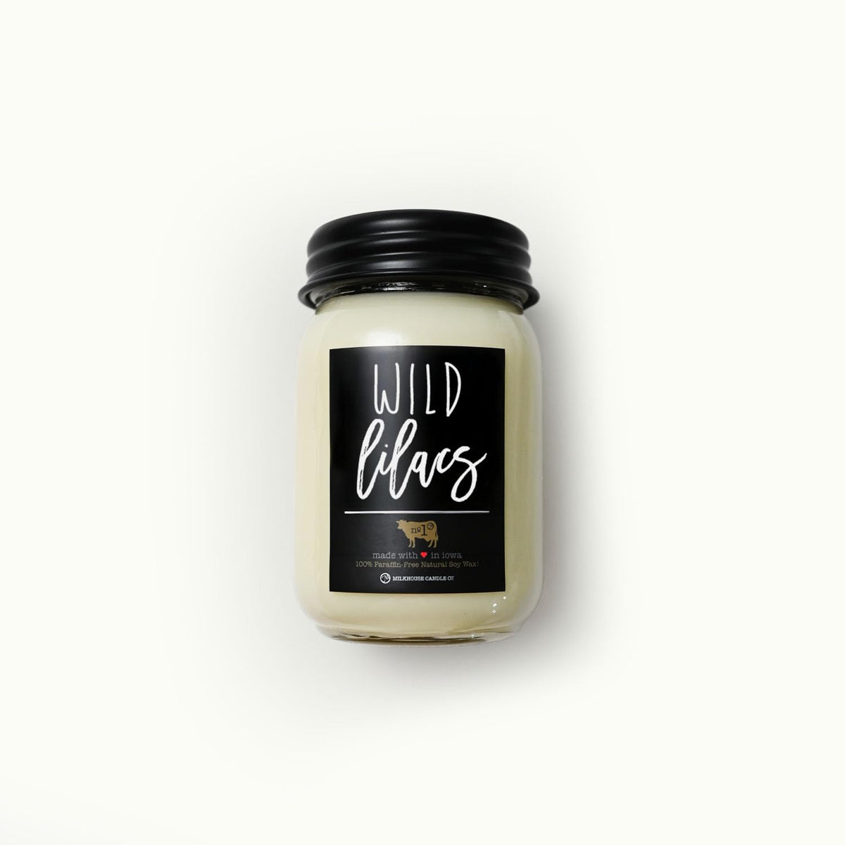 Milkhouse Wild Lilacs candle in a black metal lid offers clean, modern shelf appeal.