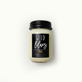 Milkhouse Wild Lilacs candle in a black metal lid offers clean, modern shelf appeal.