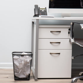 Mind Reader mesh trash bin top view, breathable design helps limit odors in shared spaces.