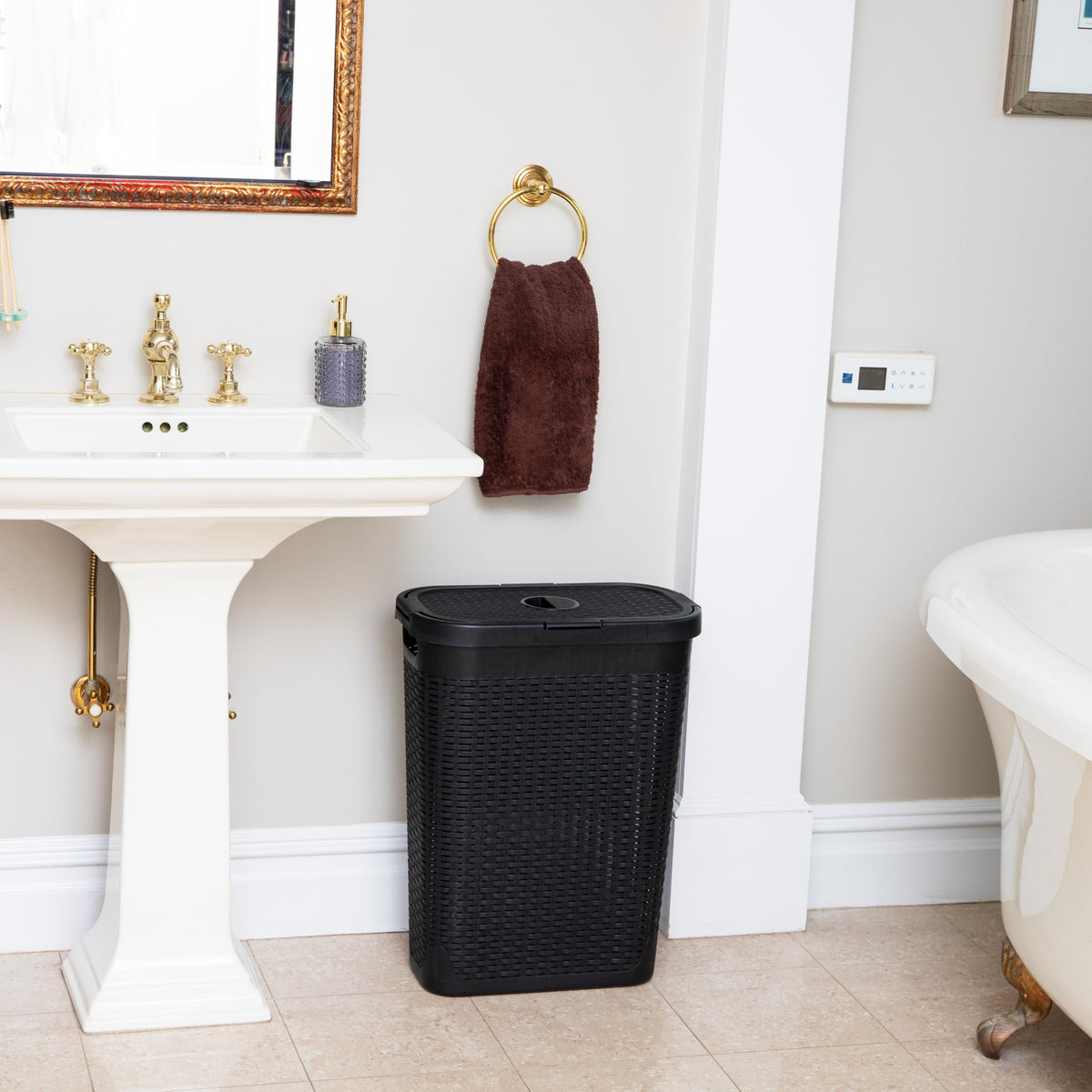 Mind Reader Slim Hamper with hinged lid keeps contents out of sight when not in use.