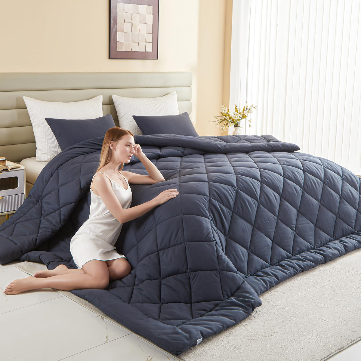 MIOTO 128x120 oversized king comforter draped over bed for full coverage.