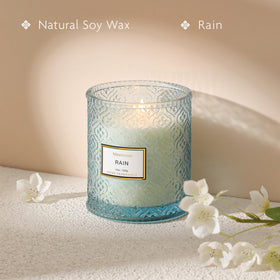 MIRASCENTS blue-patterned glass candle enhances decor with rain-inspired scent.