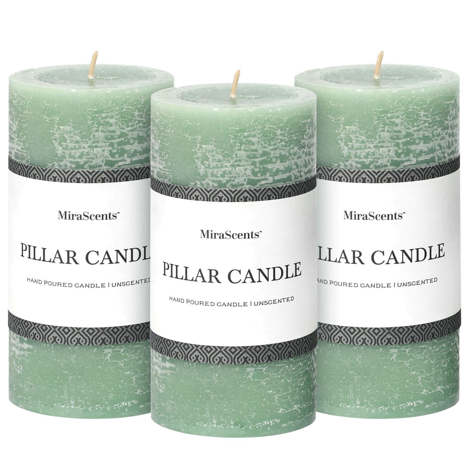 MIRASCENTS sage green 3x6-inch pillar candle with warm ambient glow for dining.