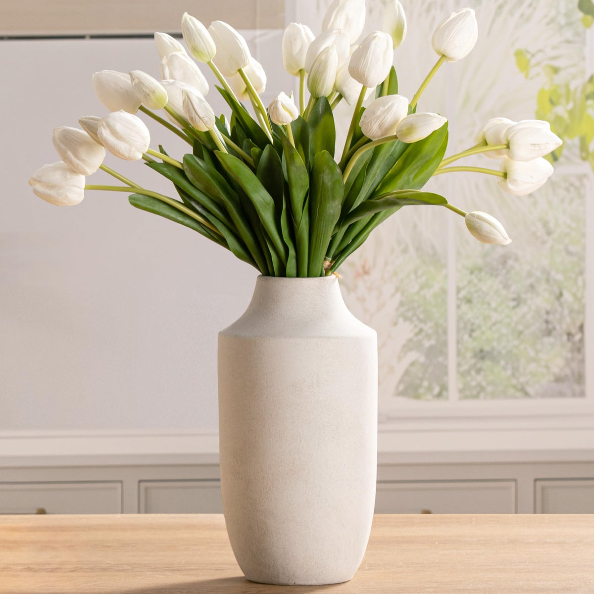 Mitt&Ditt ceramic flower vase tall silhouette enhances living room decor with rustic charm.
