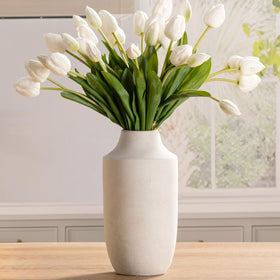 Mitt&Ditt ceramic flower vase tall silhouette enhances living room decor with rustic charm.
