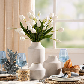 Mitt&Ditt non-slip bottom vase protects surfaces while repositioning floral arrangements.