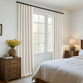 MIULEE blackout curtains in bedroom setup with elegant pleats for a restful ambiance.