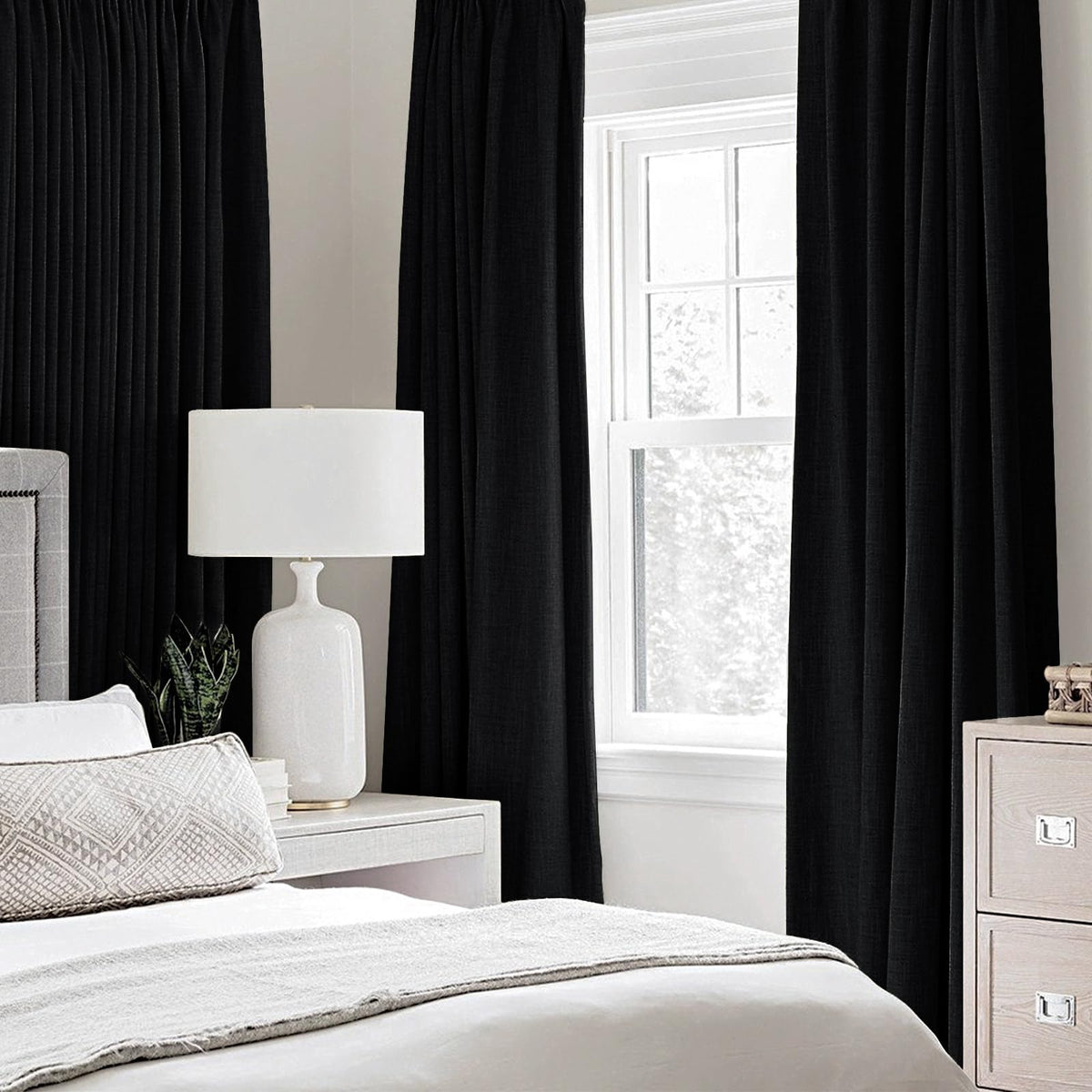 MIULEE blackout curtains closeup showing sturdy grommets for easy hanging.