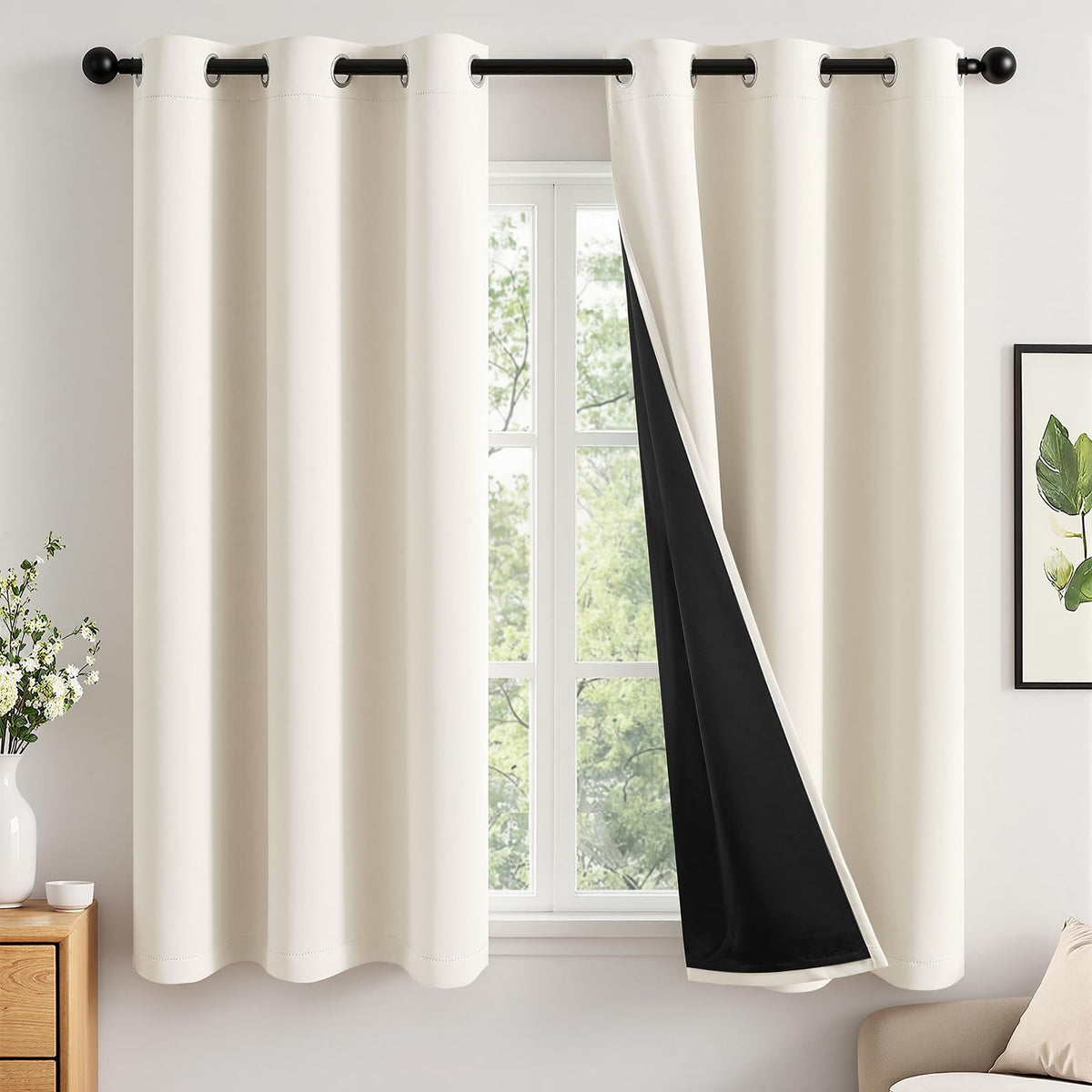 MIULEE Cream blackout curtains panel offers full light blocking for restful mornings.
