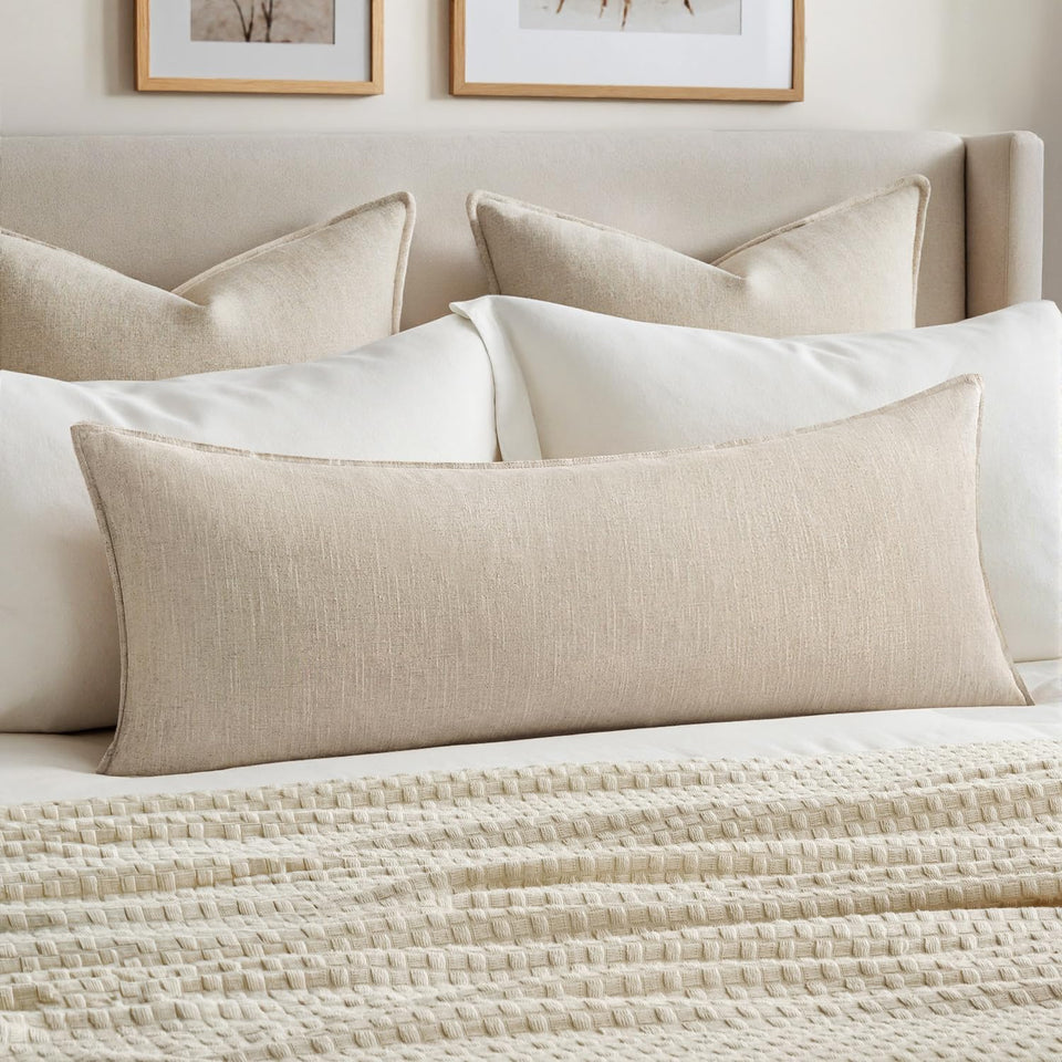 MIULEE decorative long lumbar pillow cover in natural beige adds cozy boho style to a sofa.