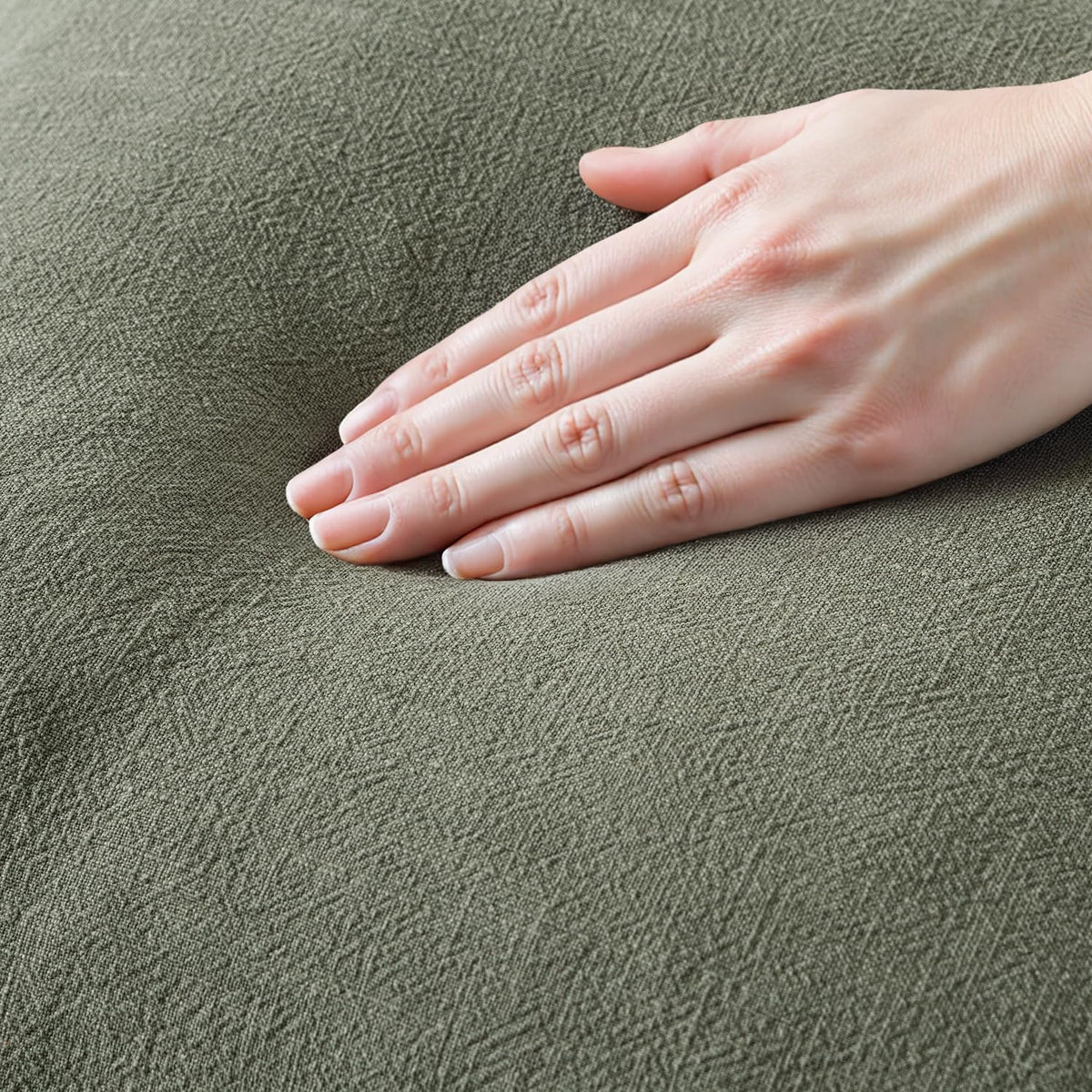 MIULEE olive fringe pillow cover on a sofa, adding boho charm