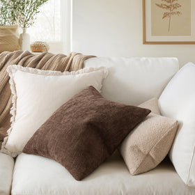 MIULEE decorative pillow cover on sofa adds warmth and texture to living room