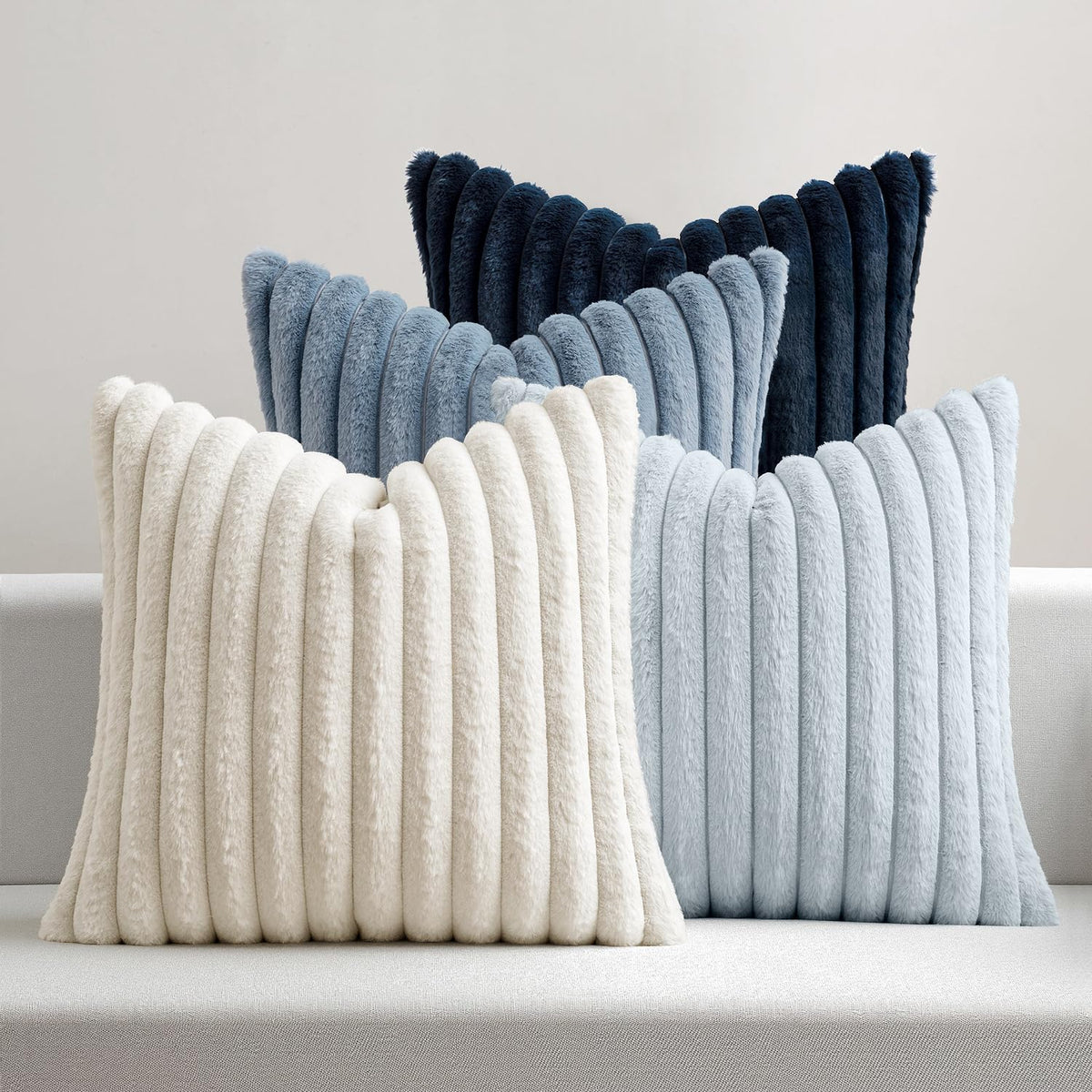 MIULEE faux fur plush pillow cover with navy stripe front adds coastal style to your living room.