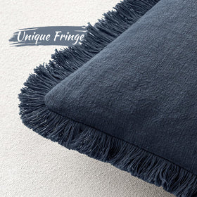 MIULEE indigo linen fringe pillow cover on sofa adds cozy style to living room.