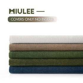 MIULEE olive green pillow covers enhancing modern living room decor.