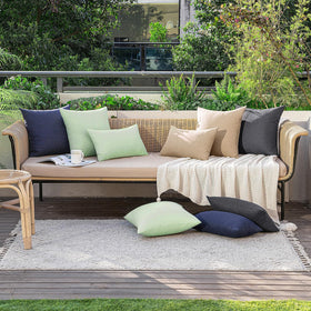 MIULEE faux linen look outdoor cover pairs with beige, white, and wood tones.