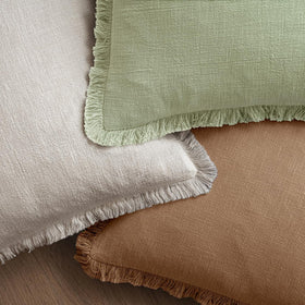 MIULEE pillow cover on sofa demonstrates versatile home decor styling.
